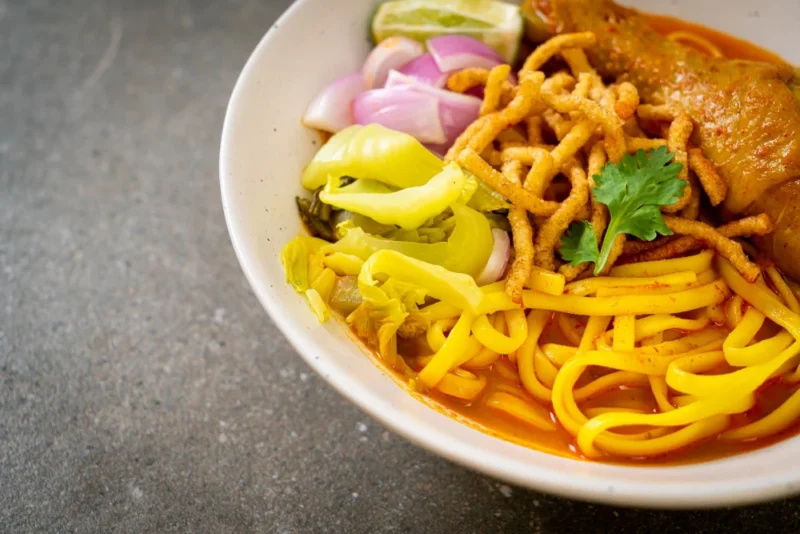 Northern Thai noodle curry soup with chicken (Kao Soi Kai) - Thai food style
